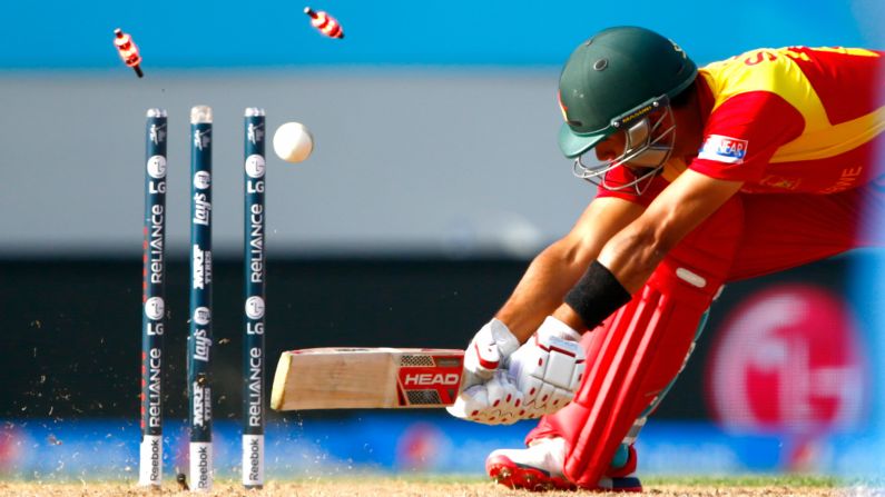 Zimbabwe's Sikandar Raza is bowled out Saturday, March 14, during a Cricket World Cup match against India in Auckland, New Zealand.
