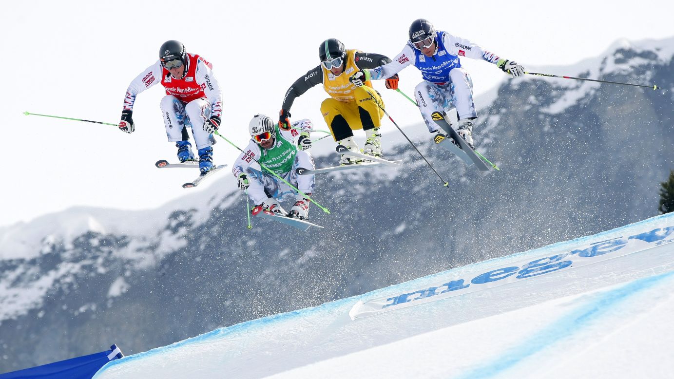 Freestyle skier Sylvain Miaillier, second from left, holds off the competition to win a World Cup ski-cross race in Megeve, France, on Friday, March 13.