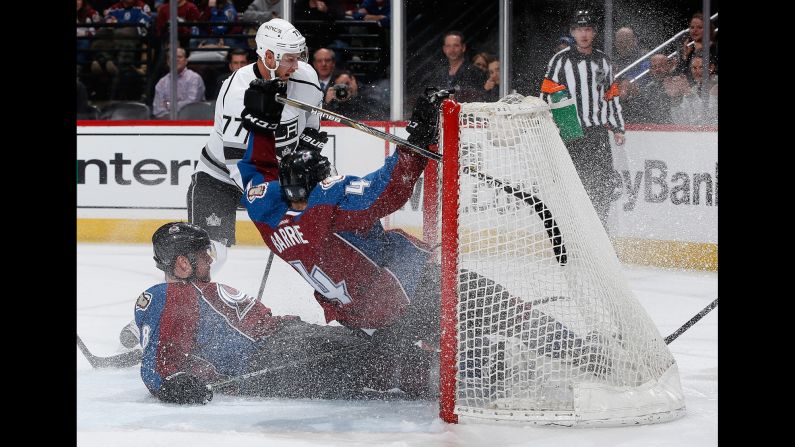 Colorado teammates Jan Hejda, left, and Tyson Barrie crash into each other as they defend an empty net against Los Angeles' Jeff Carter on Tuesday, March 10.