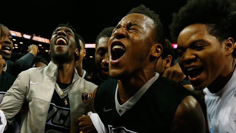 VCU basketball players celebrate Sunday, March 15, after they defeated Dayton to win the Atlantic 10 tournament in New York.