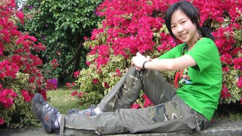 Family photos show Tong dressed in a T-shirt and with short hair. <a href="http://www.cnn.com/2015/04/03/us/iowa-killing-chinese-student/">Her roomate said Tong embraced America </a>and shed T-shirts for clothes with frills. Her hair was long, almost down to her waist, with a dyed brown streak and curls. "