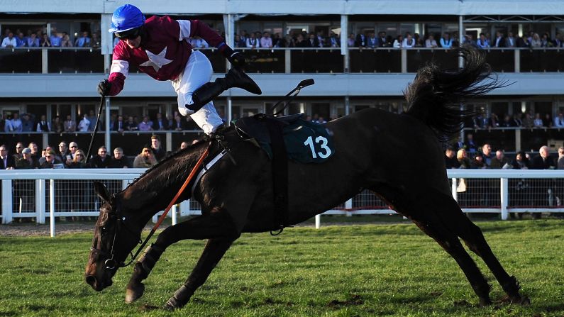 Johnny King falls off Thunder and Roses during a steeplechase race in Cheltenham, England, on Tuesday, March 10.