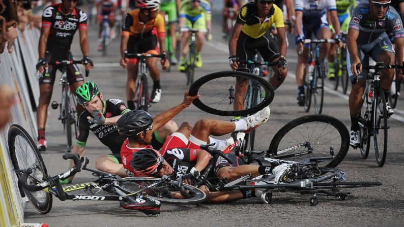 Cyclists crash on Friday, March 13, moments after finishing the sixth stage of the Tour de Langkawi in Kuala Lumpur, Malaysia.