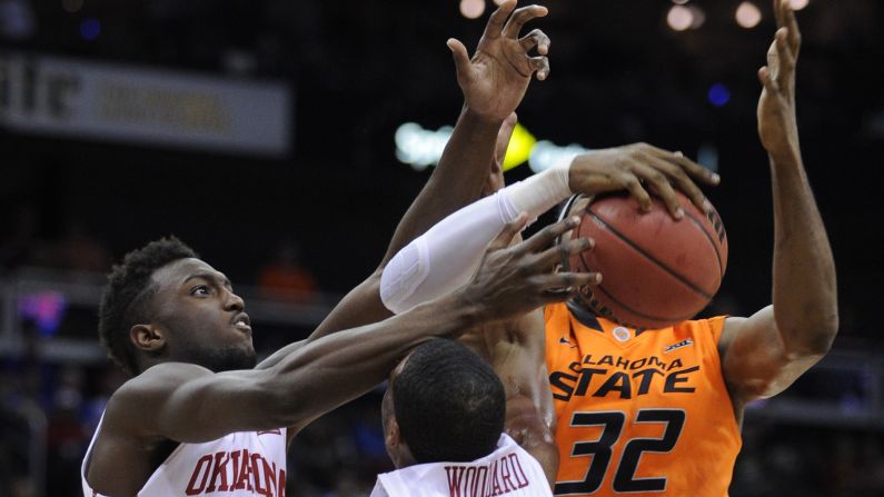 Oklahoma's Khadeem Lattin and Jordan Woodard compete with Oklahoma State's Anthony Allen Jr. during a Big 12 tournament game Thursday, March 12, in Kansas City, Missouri. <a href="index.php?page=&url=http%3A%2F%2Fwww.cnn.com%2F2015%2F03%2F10%2Fsport%2Fgallery%2Fwhat-a-shot-0310%2Findex.html" target="_blank">See 34 amazing sports photos from last week</a>