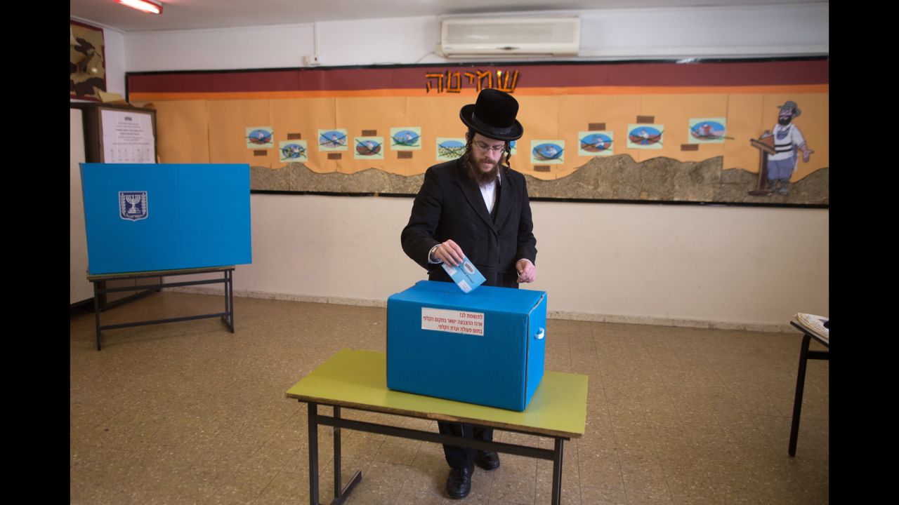 An ultra-Orthodox Jewish man casts his ballot at a Jerusalem polling station on March 17.