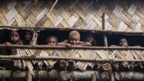 Children gather in a tree house last November, months before cyclone.