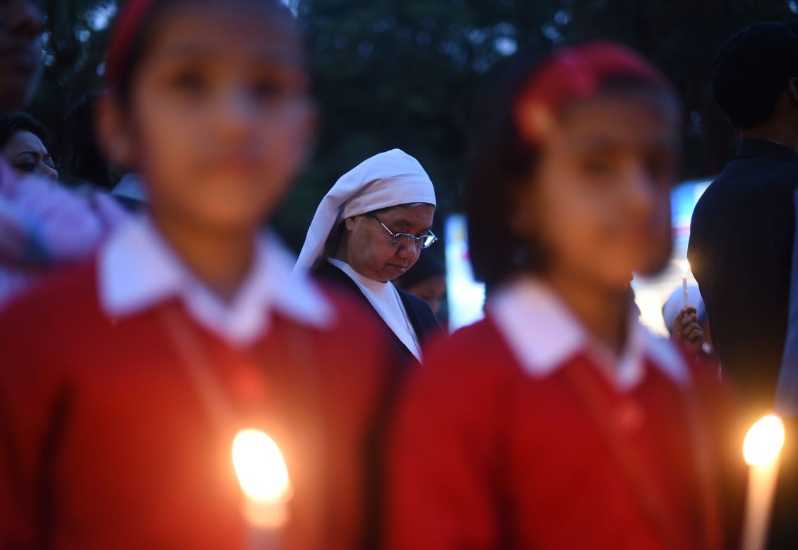 Hundreds of demonstrators take part in a candlelight vigil and silent protest against the alleged rape of a nun in India on March 16.