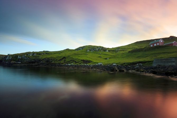 You don't need a solar eclipse as an excuse to visit this far-flung island. Stunning colors are the norm over the village of Kurdalsvegur. 