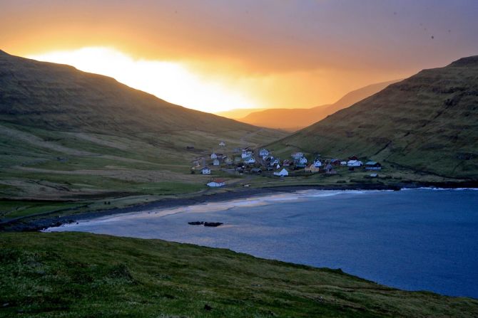 This cozy village on <a  target="_blank" target="_blank">Sandoy island</a>'s east coast is home to the remains of a 14th-century farmhouse in traditional Faroese style.