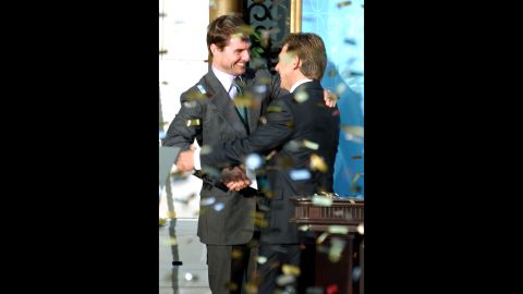 Confetti rains down as actor Tom Cruise, left, embraces David Miscavige, the leader of the Church of Scientology, at the opening of a new church in Madrid in September 2004. Cruise is one of the world's most prominent Scientologists. "What I believe in my own life is that it's a search for how I can do things better, whether it's being a better man or a better father or finding ways for myself to improve,"  Cruise told Playboy magazine. "Individuals have to decide what is true and real for them."