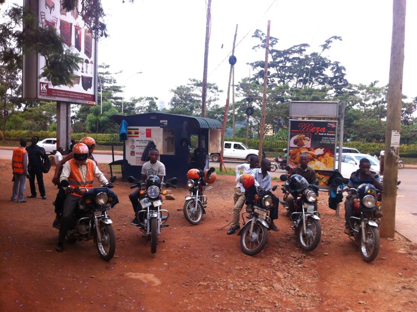 The SafeBodas standout from standard boda drivers through their high visibility jackets and helmets.