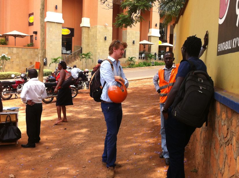The Start-up is run by Alastair Sussock (left) and Ricky Rapa Thomson (right) whose goal is to professionalize transport first in Kampala then across Uganda and other African countries using boda bodas. They are pictured here talking to a driver on his patch in Kisementi.