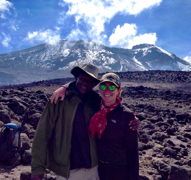Brooke poses with her group's Kilimanjaro guide, Dismass Mariki.