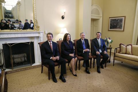 Then-Senate Minority Leader Mitch McConnell (second right), poses with Republican senators-elect Jeff Flake (left), Deb Fischer (second left), and Cruz (right) at the U.S. Capitol on November 13, 2012, in Washington, D.C.