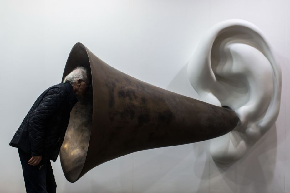 It wasn't the only mind-bending artwork on show at the three-day fair. Here, a visitor inspects American artist John Baldessari's "Beethoven's Trumpet (With Ear) Opus # 133." 