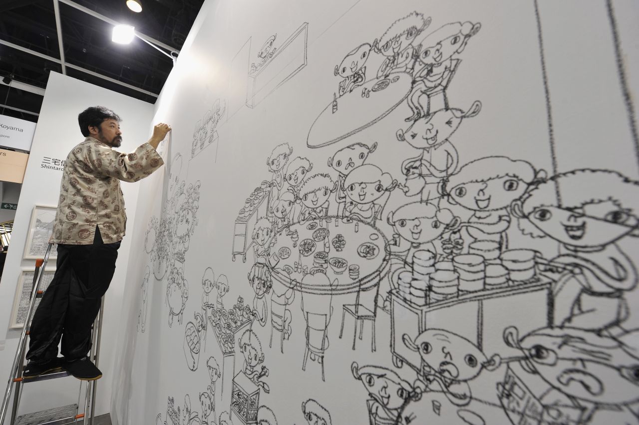 Japanese artist Shintaro Miyake draws a sketch as part of his "Excursions in Asia" series. 