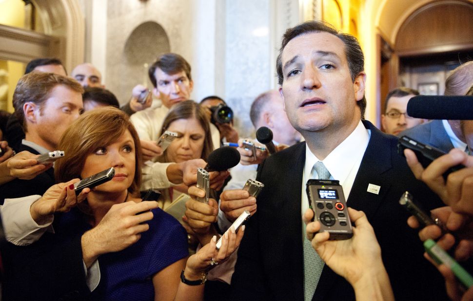 Cruz speaks to reporters on September 25, 2013, after ending his talk-a-thon on the floor of the US Senate in Washington, D.C.