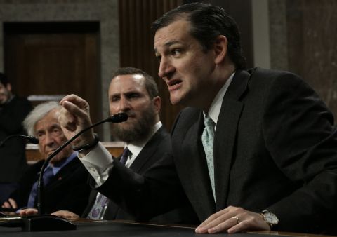 Nobel Peace Laureate Elie Wiesel (left) listens as Cruz (right) speaks during a roundtable discussion on Capitol Hill March 2, 2015 in Washington, D.C. Wiesel, Cruz and Rabbi Scmuley Boteach (center) participated in a discussion entitled 'The Meaning of Never Again: Guarding Against a Nuclear Iran.'