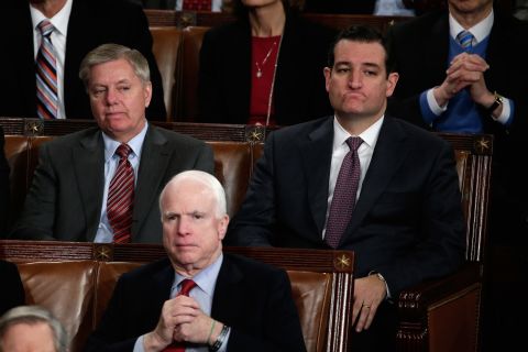 From left, U.S. Sens. Lindsey Graham, John McCain and Cruz listen as President Barack Obama delivers his State of the Union address in January 2014.