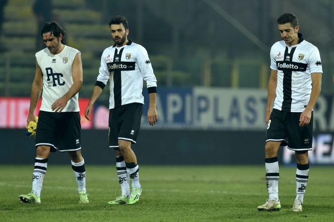 Alessandro Lucarelli (L), Raffaele Palladino (C) and Zouhair Feddal of Parma look dejected at the end of a 1-0 home loss to AC Chievo Verona on February 11. The players have not been paid all season. 