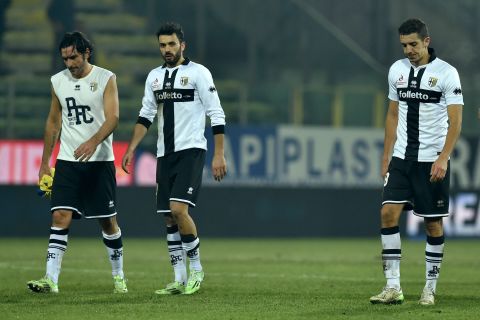 Alessandro Lucarelli (L), Raffaele Palladino (C) and Zouhair Feddal of Parma look dejected at the end of a 1-0 home loss to AC Chievo Verona on February 11. The players have not been paid all season. 