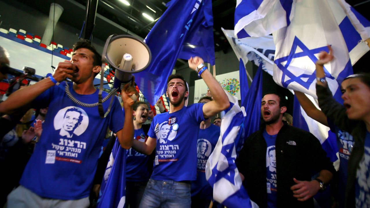 Supporters of the Zionist Union alliance take part in early celebrations as they wait for election results March 17 in Tel Aviv.