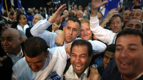 Likud supporters celebrate in Tel Aviv after some exit poll results were announced Tuesday, March 17.