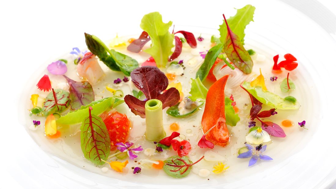 It's not just a salad. It's a carefully arranged edible garden. Fresh leaves and peppered flowers come together with rich lobster and cream of lettuce on a lake of jellied tomato juice.