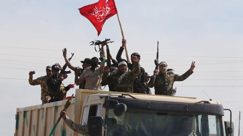 Iraqi Shiite fighters from the Popular Mobilisation units head towards the multi-ethnic Iraqi city of Tikrit, on March 17, 2015 after recapturing the town of Al-Alam from Islamic State (IS) fighters earlier in the month. Loyalists had already failed three times to retake the nearby city of Tikrit, the hometown of Saddam Hussein, which was captured by IS last summer. AFP PHOTO / AHMAD AL-RUBAYEAHMAD AL-RUBAYE/AFP/Getty Images