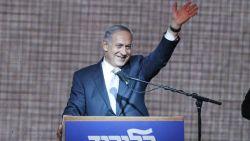 Israeli Prime Minister Benjamin Netanyahu waves from the stage as he reacts to exit poll figures in Israel's parliamentary elections late on March 17, 2015 in the city of Tel Aviv. Netanyahu claimed victory in elections as exit polls put him neck-and-neck with centre-left rivals after a late fightback in his bid for a third straight term. AFP PHOTO / JACK GUEZJACK GUEZ/AFP/Getty Images