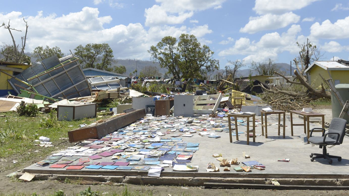 Books recovered from a school are left out to dry in Port Vila on March 18.