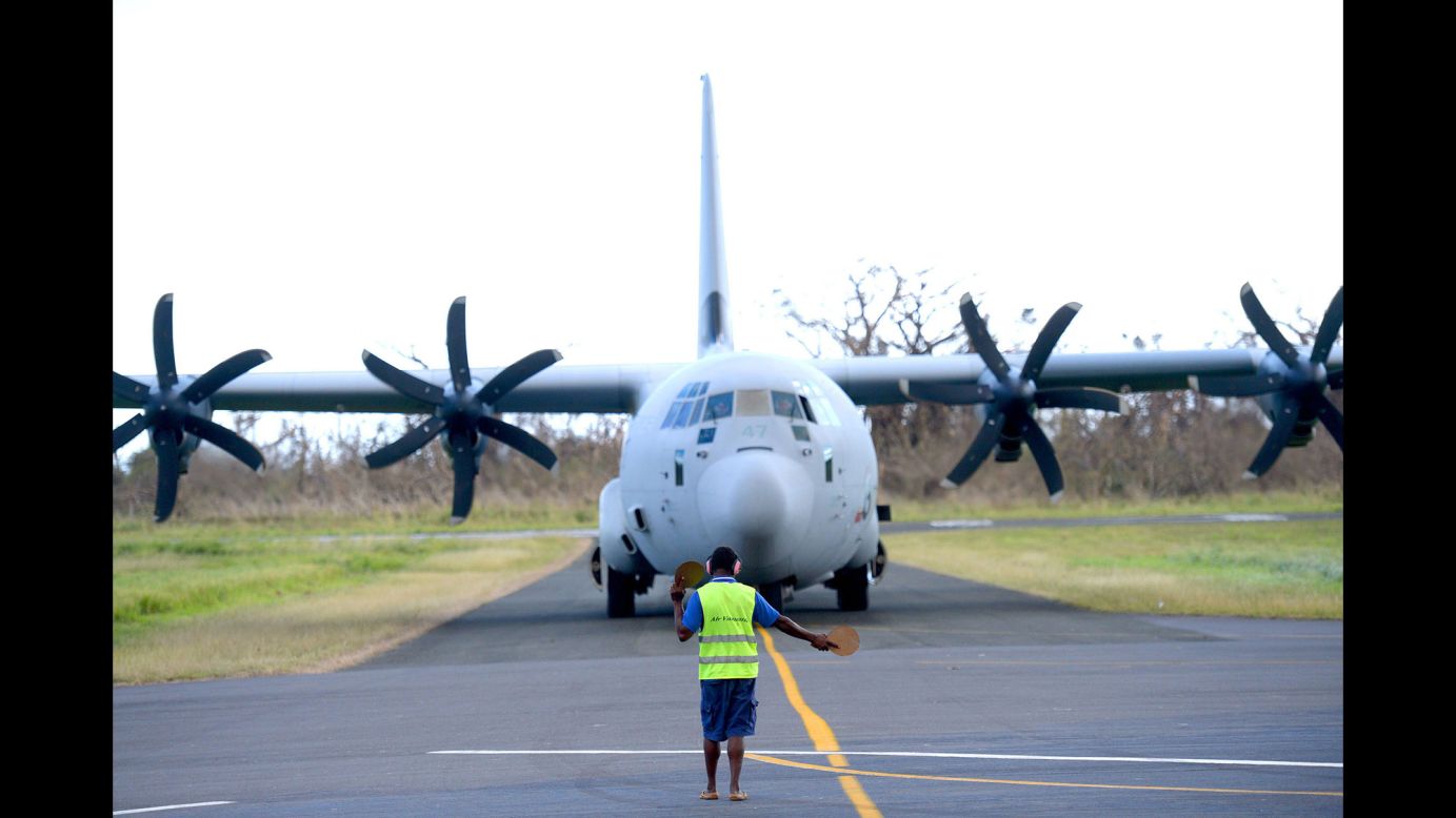 An Australian army relief aircraft arrives with supplies at the airport in Tanna on March 18.