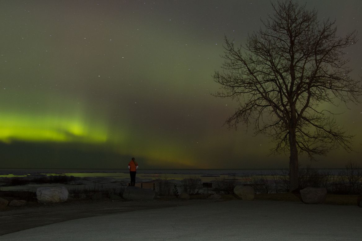 A green aurora stretches across the Michigan sky on Tuesday, March 17. <a href="http://ireport.cnn.com/docs/DOC-1225557">Travis Peltz</a> viewed the celestial show from his hometown of Rogers City.