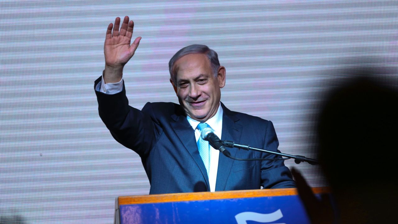 Israeli Prime Minister Benjamin Netanyahu greets supporters at the party's election headquarters In Tel Aviv. Wednesday, March 18, 2015.