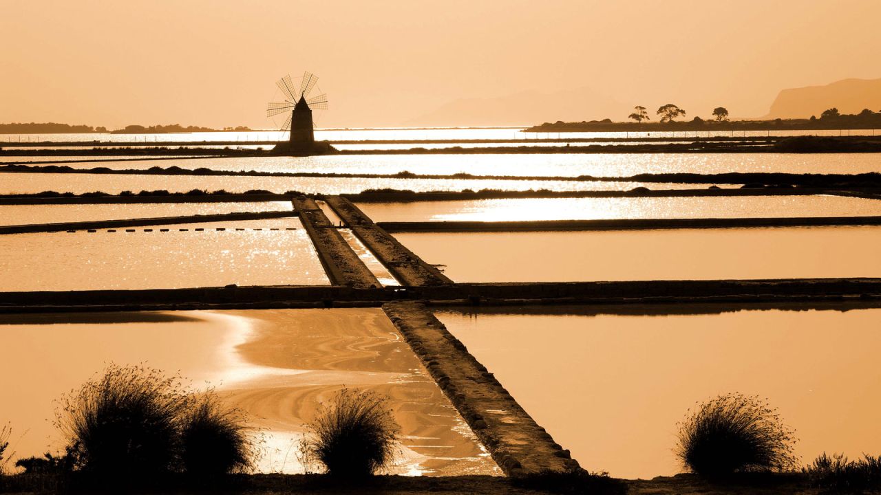 Known for its sweet wine-producing vineyards and salt pools, Marsala's name comes from the Arabic "Marsa Allah," meaning God's harbor. <br />Surrounded by an archipelago of small islands, the lagoon boasts a Phoenician vessel and settlement. <br />It's dotted with ancient windmills and often sees spectacular sunsets.<br /><em>Strada Provinciale 21, Marsala, Trapani</em>