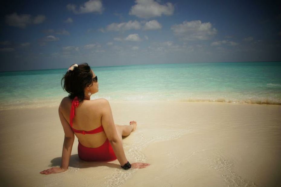 <a href="http://ireport.cnn.com/docs/DOC-1222529">iReporter Adam Fredeus</a> snapped this photo of his girlfriend during a day-trip to a sandbank near Hanimaadhoo in the Maldives. Fredeus, who lives in Antwerp, Belgium, said that by staying in smaller, less expensive local resorts, they were able to experience the Maldives "in a natural way with knowing the locals and understanding their culture." The Republic of Maldives is an independent island nation of nearly 1,200 islands and sandbanks in the Indian Ocean.