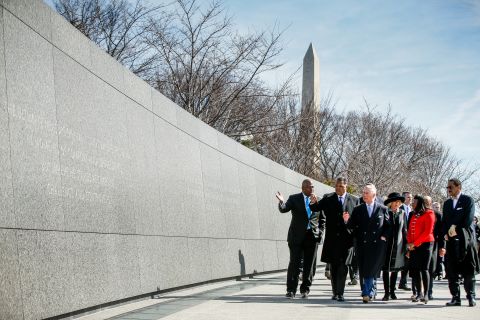 Charles, third from left, and Camilla, wearing the hat, tour the Martin Luther King Jr. Memorial in Washington on March 18. Among those accompanying the royal couple are the Rev. Jesse Jackson, second from left; U.S. Rep, Terri Sewell, second from right; and chief architect Ed Jackson, far right.