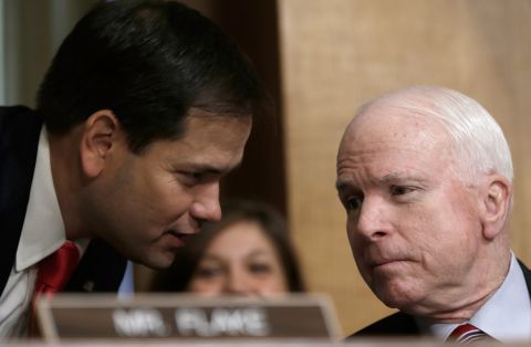 Rubio confers with McCain as U.S. Ambassador to Syria Robert Ford testifies before the Senate Foreign Relations Committee in October 2013.