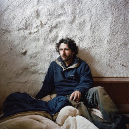 In this photo taken while Bruy was traveling through the Sierra de Cazorla in Andalusia, Spain, a man named Jean shelters from the snow and freezing cold outside his makeshift dwelling.<br />Bruy says what makes these individuals different from the rest of society is that they have had the courage to give up the comfortable life to pursue something else.<br />