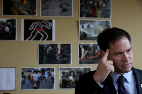 Rubio speaks to the media in front of a wall dedicated to the victims of the violence in Venezuela as he shows support for the Venezuelan community at a restaurant in Doral, Florida, in April 2014.