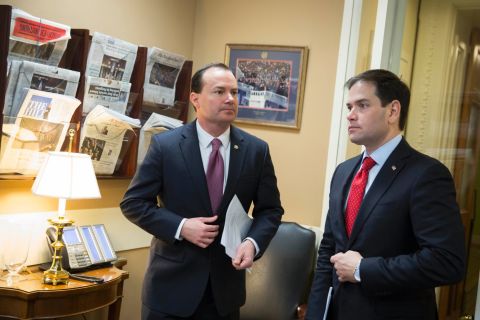 Sen. Mike Lee, left, and Rubio talk before a news conference to introduce their proposal for an overhaul of the tax code in March.
