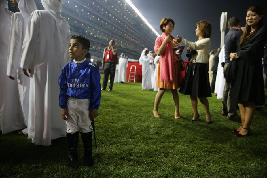 The attendees come in all shapes and sizes, including this boy dressed in the colors of Godolphin Stables.