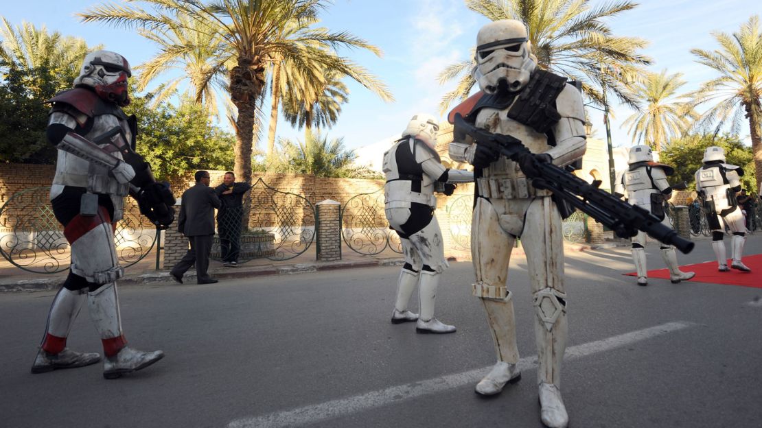 Fans pose in "Star Wars" costume at an event celebrating Tunisia's links to the film series.