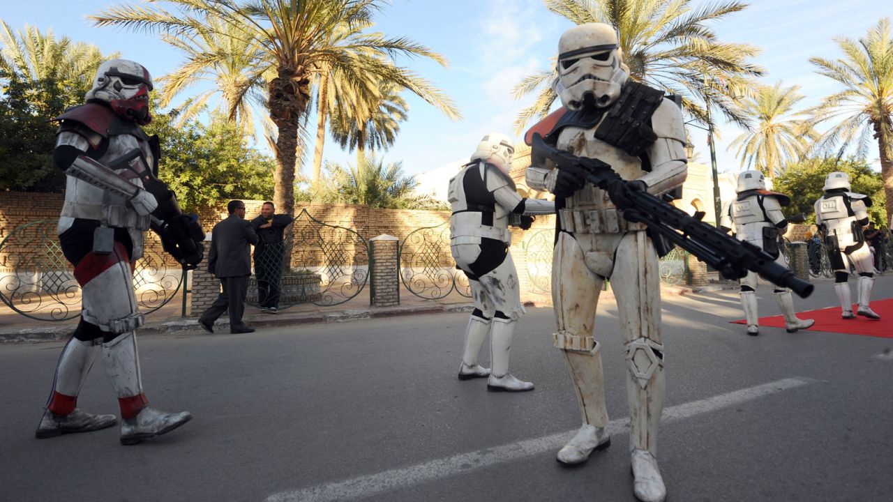 Fans pose in "Star Wars" costume at an event celebrating Tunisia's links to the film series.