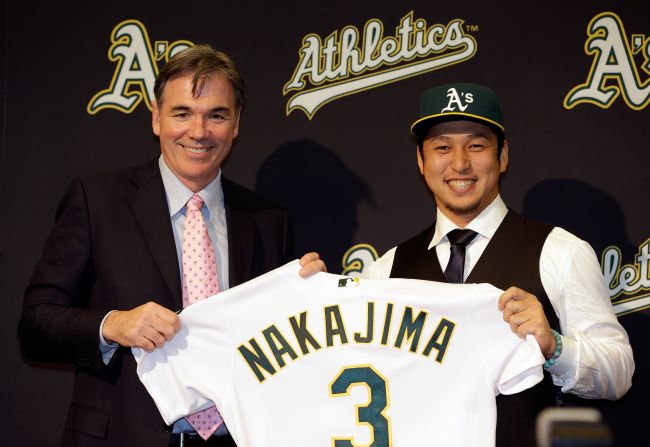 Oakland Athletics general manager Billy Beane -- famous for signing players on a budget -- introduces Hiroyuki Nakajima of Japan to the Oakland Athletics at the O.co Coliseum on December 18, 2012 in Oakland, California. 