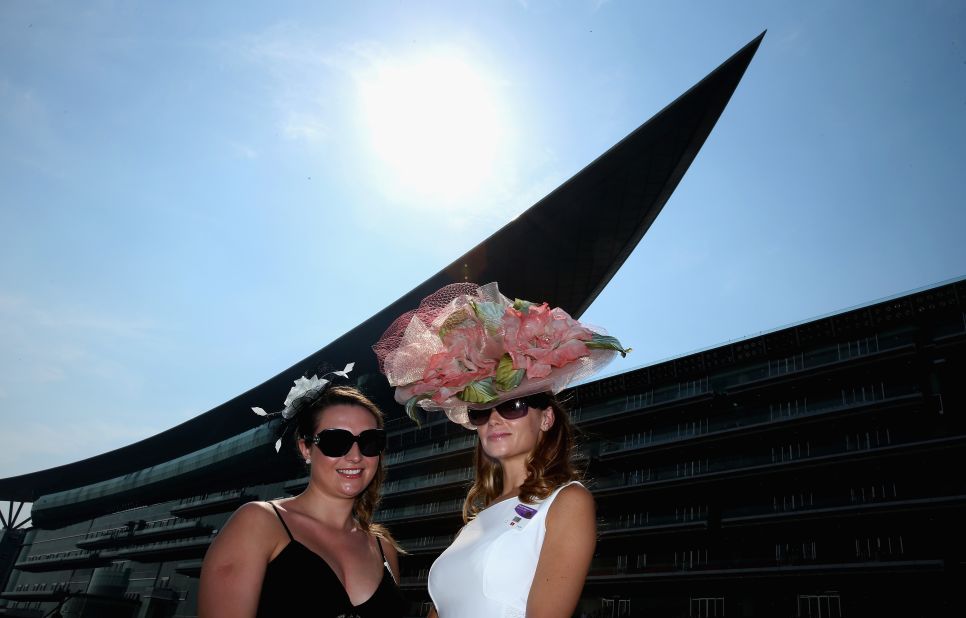It is now held at Meydan Racecourse whose grandstand is nicely offset by some of the headwear on display.