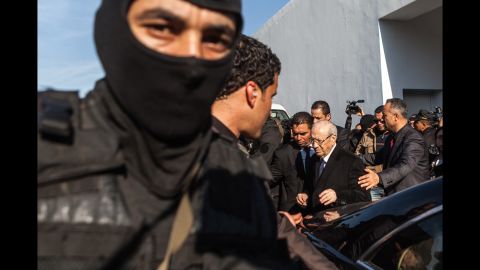 Tunisian President Beji Caid Essebsi leaves a Tunis hospital after visiting those injured in the attack.