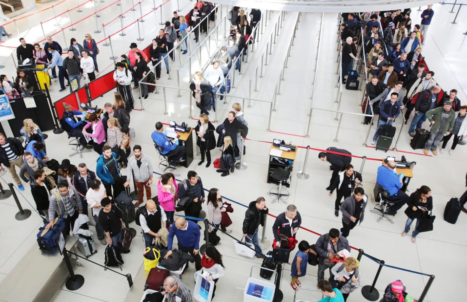 Passengers at a security checkpoint in John F. Kennedy International Airport in New York. The Transportation Security Administration has a program called SPOT that lets behavior detection officers screen passengers' facial expressions for potential malicious intent. 
