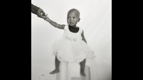 A 10-month-old girl named Buseiwa was one of the many refugees that Pieter ten Hoopen took portraits of in Sudan's capital of Khartoum. Just before she entered the studio, she had taken a blood test for malaria.