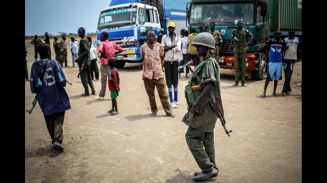A youngster in military uniform in the South Sudan Democratic Movement/Army in Jonglei state in March 2014. Despite the dominant image of these soldiers as young boys, it is estimated that globally as many as 40% are girls.